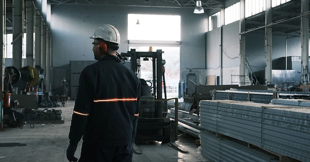 Modern electrical equipment factory worker